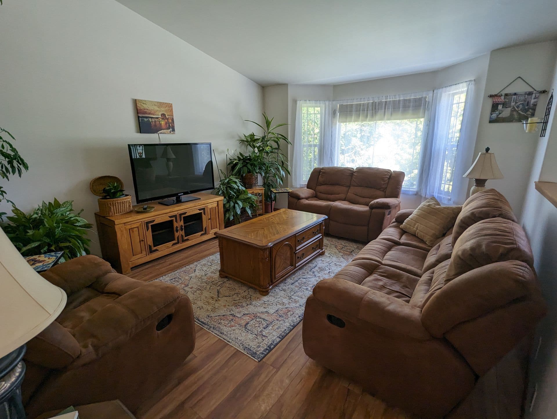 Comfortable living room with recliners and TV